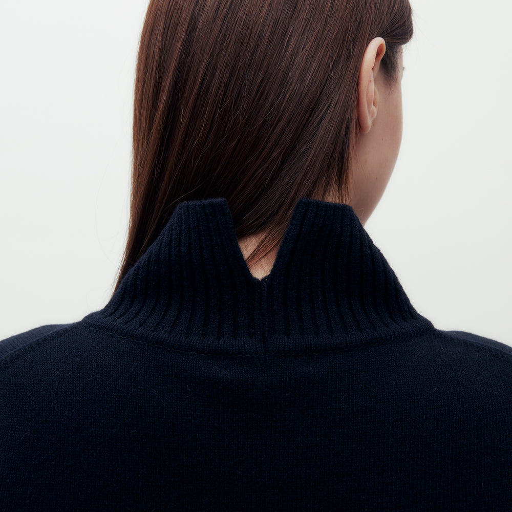 
                      
                        High Neck Wool Sweater
                      
                    